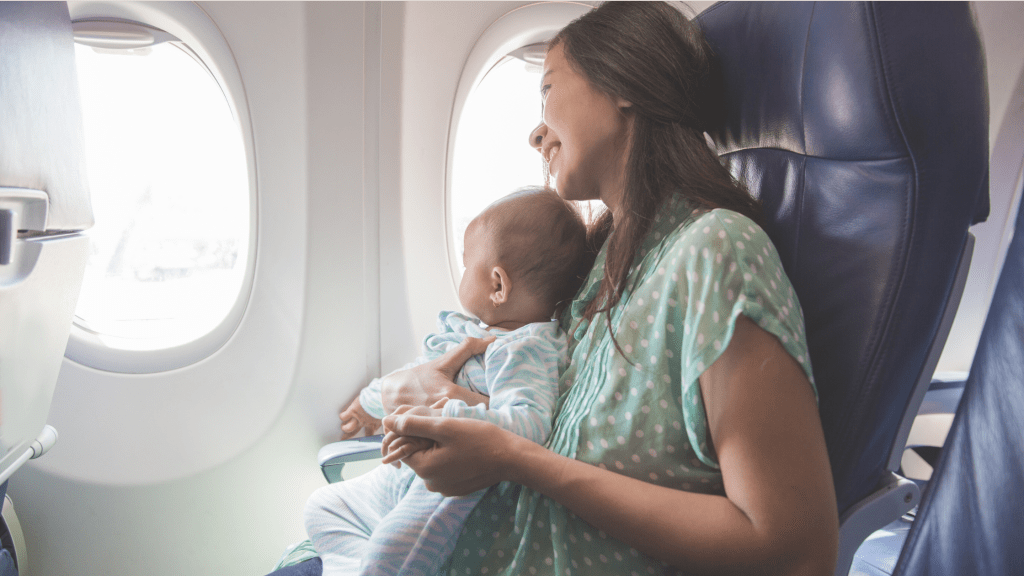 happy mom and baby on an airplane benefiting from tips for traveling with baby